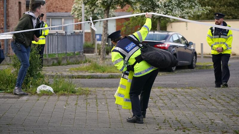 Gardaí cordoned off the scene in Ballymun where  a middle-aged woman was fatally injured at a house. Photograph: Niall Carson/PA Wire