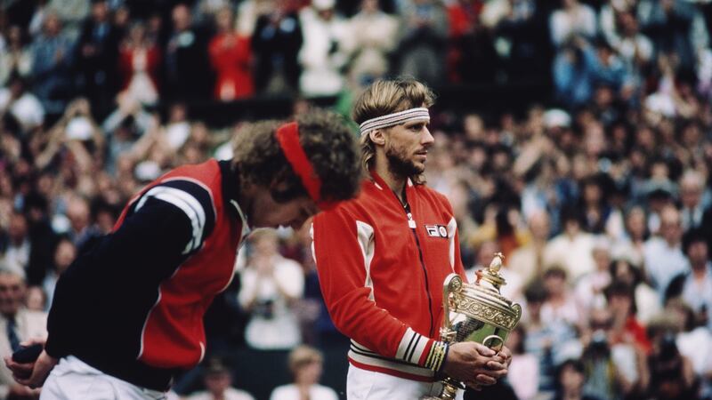 Björn Borg  holds the trophy  as John McEnroe looks down after losing their men’s singles final  at  Wimbledon in 1980. Photograph: Steve Powell/Allsport/Getty Images