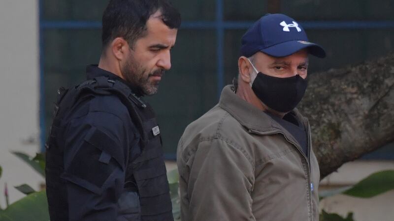 Fabricio Queiroz (right) arrives at the Legal Medicine Institute in Sao Paulo, Brazil, after his arrest. Photograph: Nelson Almeida/AFP via Getty Images