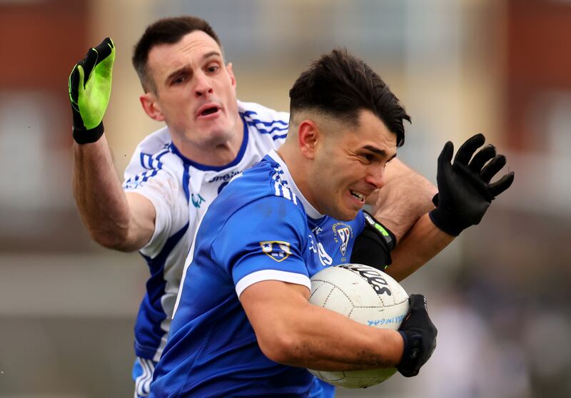 Naas’s Eoin Doyle tackles TJ Cox of St Loman's during the Leinster SFC semi-final at TEG Cusack Park, Mullingar. Photograph: James Crombie/Inpho 