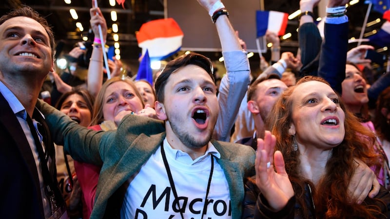 Supporters of Emmanuel Macron, French presidential election candidate for the En Marche! movement, celebrate after the results of the first round of the presidential election, on April 23rd, 2017 at the Parc des Expositions in Paris. Photograph: Eric Feferberg/AFP/Getty Images