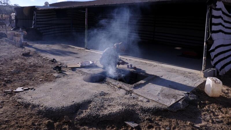 A Bedouin woman preparing coffee at a pastoral nomadic Bedouin tribe compound near Mitzpe Ramon a town in the Negev desert in southern Israel. Photograph: Getty