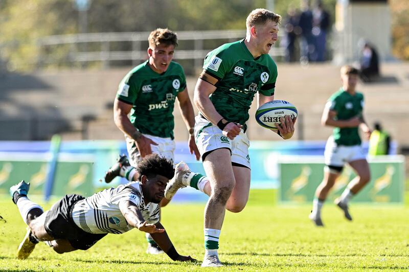 Ireland's Andrew Osborne gets away from the tackle of Fiji's Epeli Waqaicece to score a try. Photograph: Darren Stewart/Inpho/SteveHaagSports