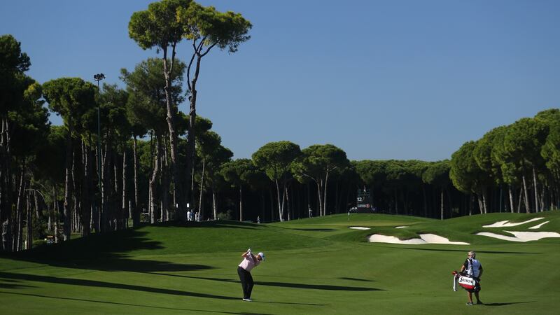 Lowry plays his second shot into the 12th green. Photo: Warren Little/Getty Images