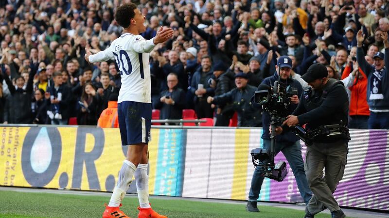 Dele Alli celebrates putting Tottenham Hotspur 3-1 up against Liverpool. Photograph: Richard Heathcote/Getty