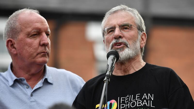 Gerry Adams (right) attends a rally alongside Bobby Storey called in support of the former Sinn Féin president on Monday in Belfast after explosive devices were thrown at the men’s homes. Photograph: Getty