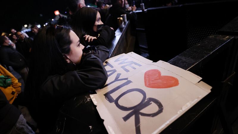 A Foos fan leans on a sign at the Festival Estereo Picnic after the news of Hawkins’ death broke. Photograph: Mauricio Duenas Castaneda/EPA