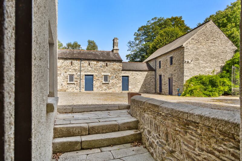 Further accomodation lies in two cut stone buildings