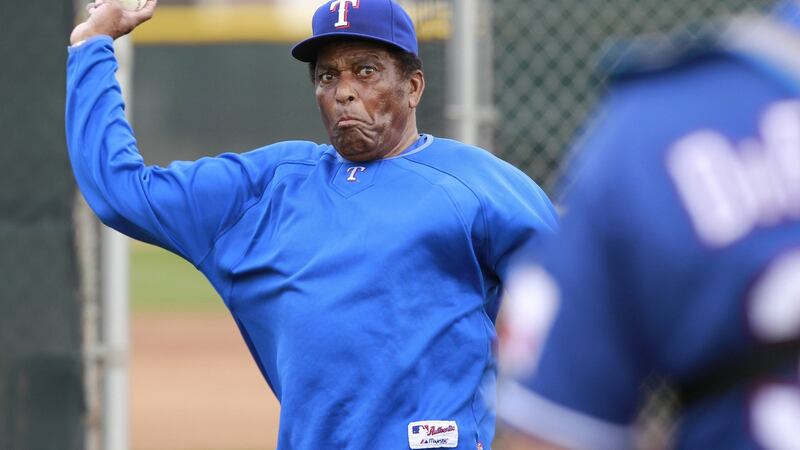 Pride throws to Texas Rangers catcher Vin DiFazio in 2011. Photo: Ron T. Ennis/Fort Worth Star-Telegram/Tribune News Service via Getty Images