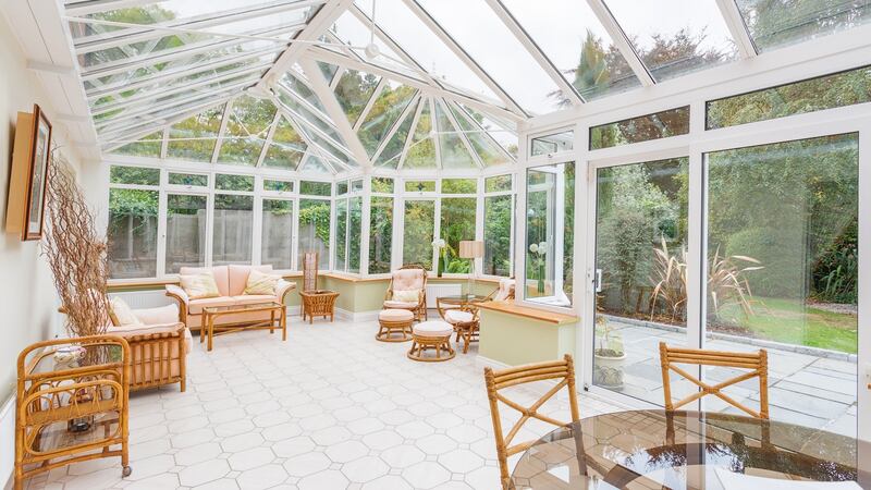 There is a large conservatory to the rear overlooking the compact southwest-facing garden.