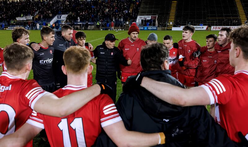 Derry manager Mickey Harte speaks to his team before the game against Cavan. Photograph: James Crombie/Inpho