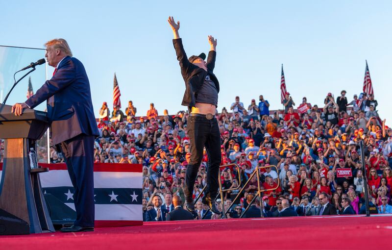 Elon Musk captured mid-leap, looking for all the world as though being finally raptured up to Mars. Photograph: Doug Mills/The New York Times
                      