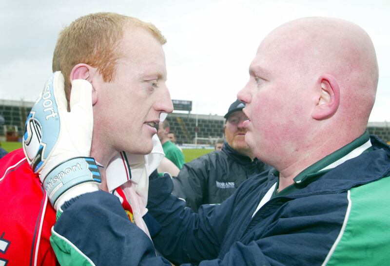 Limerick's John Quane and Seamus O'Donnell celebrate their victory against Cork in the Munster Senior Football Championship first round in 2003. Photograph: Tom Honan/Inpho