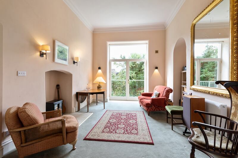 The living room is classily yet understatedly furnished