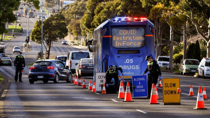 Police pull vehicles aside at a checkpoint in the locked-down suburb of Broadmeadows in Melbourne. Photograph: William West/AFP via Getty Images