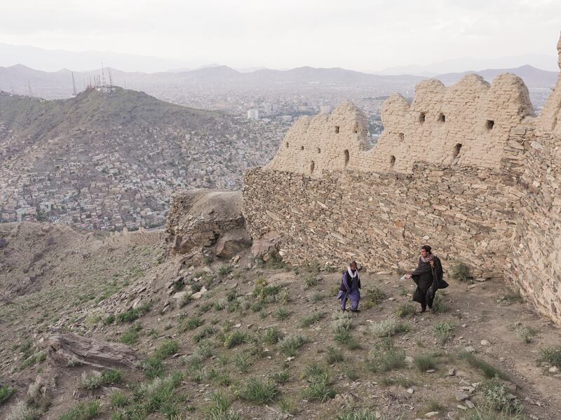 The Great Wall of Kabul runs atop the Sher Darwaza (Lion's Door) mountains, towering over the city below. Photograph: Joe Sheffer 