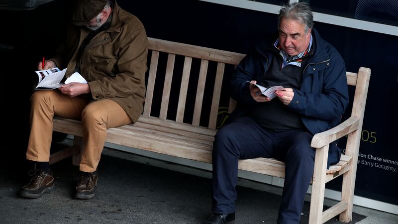 Racegoers study the form  at Cheltenham on Thursday. Photograph: INPHO/Dan Sheridan