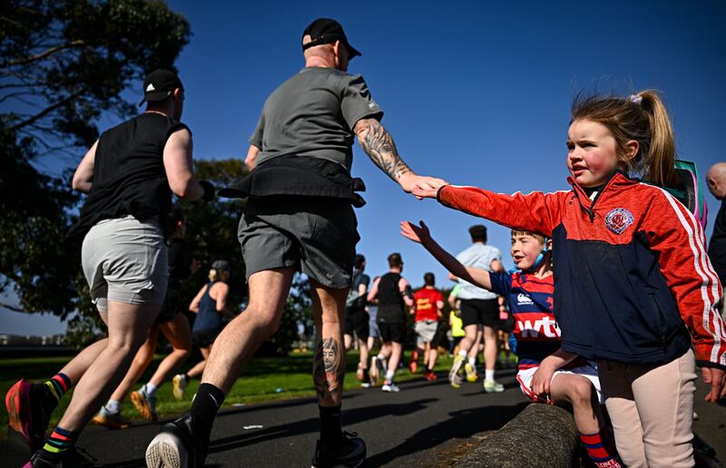 Julia Wafer (4) from Clontarf cheers on participants during the inaugural Dublin City Half Marathon. Photograph:  Sam Barnes/Sportsfile 