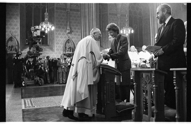 Archbishop of Armagh Cathal Daly greets Mary Robinson, who attended Daly's installation in St Patrick's Cathedral, Armagh, with her husband, Nick, in December 1990. Photograph: Frank Miller