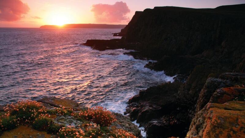 Rathlin Island is an island off the coast of County Antrim in Northern Ireland, and is the northernmost point of the region. Six miles from the mainland, Rathlin is the only inhabited offshore island in Northern Ireland, and is the most northerly inhabited island off the Irish coast. The L-shaped island is only 15 miles from the Mull of Kintyre and is one of Northern Ireland's Special Areas of Conservation due to it's large bird's colony.