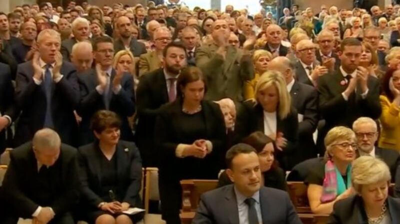 The Sinn Féin leaders join the standing ovation.