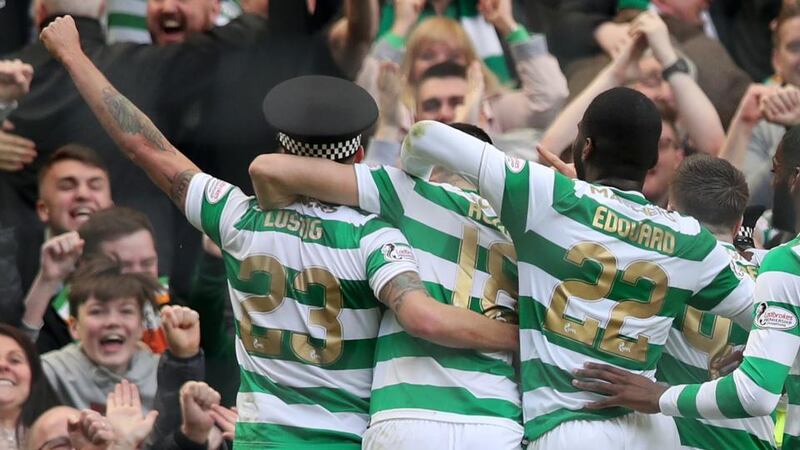 Mikael Lustig celebrates Celtic’s third goal against Rangers. Photograph: Ian MacNicol/Getty