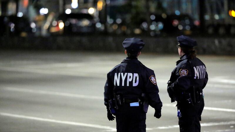 Police look towards the scene of the attack on West Side Highway in Manhattan. Photograph: Andrew Kelly/Reuters