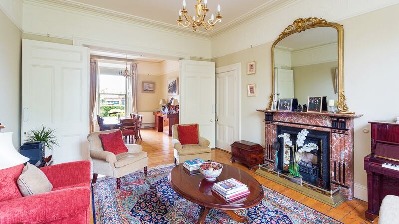 Fireplaces in both reception rooms are marble and large, with tiled insets and gas fires