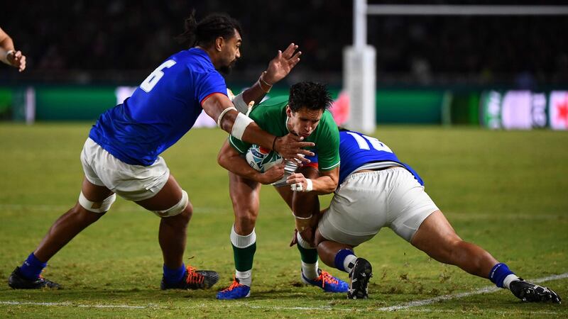 Ireland’s Joey Carbery is tackled by Samoa flanker Chris Vui  hooker Ray Niuia. Photograph: Gabriel Bouys/AFP/Getty