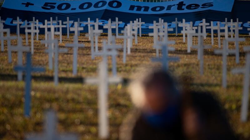 Crosses honour of victims of coronavirus in front of the Nacional Congress in Brasilia. Brazil has had more than 1.4 million confirmed cases of coronavirus and more than 60,000 deaths attributed to Covid-19. Photograph: Andressa Anholete/Getty Images