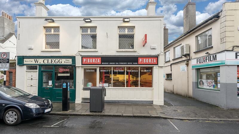 16/16a Castle Street, Dalkey: The building with a ground-floor takeaway and second-floor apartment is for sale for €450,000.