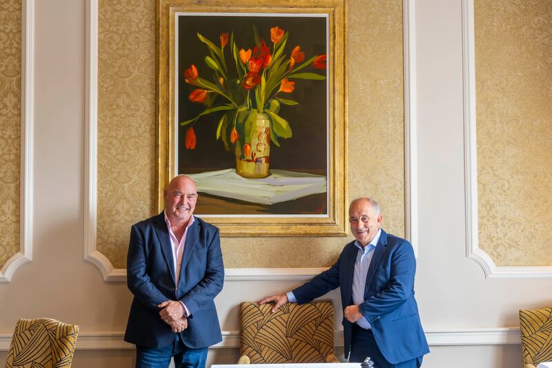 Artist Martin Mooney and Oliver Gormley at The K Club in front of Mooney's painting Tangerine and Red Tulips on Cloth (€20,000). Photograph: Patrick Browne