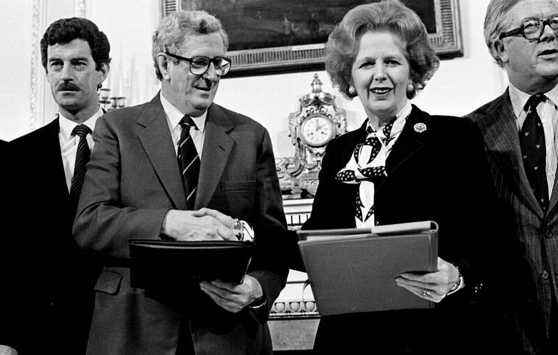 Then taoiseach Garret FitzGerald and then British prime minister Margaret Thatcher shake hands after signing the Anglo-Irish Agreement in November 1985. Then tánaiste, Dick Spring, is to the left. Photograph: Eamonn Farrell/RollingNews.ie