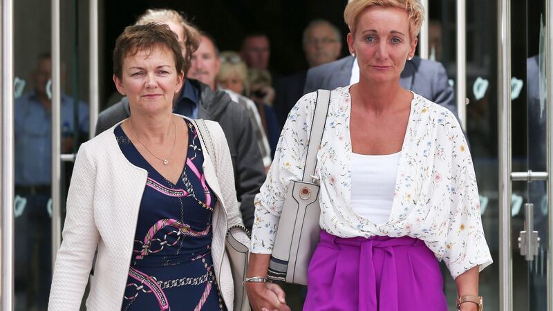 Sisters Deirdre Fahy (left) and Stephanie Hickey leave the Central Criminal Court today after the sentencing hearing of Bartholomew Prendergast. Photograph:  Collins Courts.