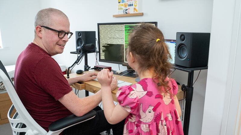 Kevin working from home with daughter Neeta