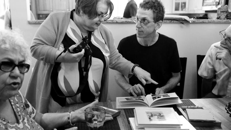 Phylis Pullman, first cousin to Alice Collins Plebuch, and Alice (centre) chat with Alice’s second cousins Dan Klein and Jerry Klein, in Seaford, New York. Photograph: Yana Paskova for The Washington Post/Getty Images