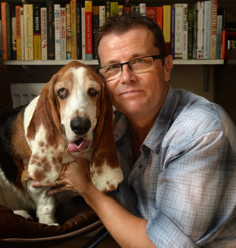 Writer Paul Howard, with his dog Humphrey, at home in Co Wicklow. Photograph: Dara Mac Dónaill 



