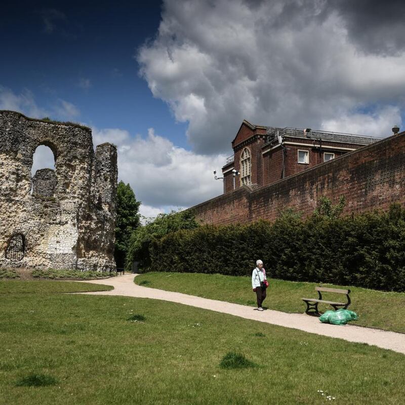 Reading Gaol: The perimeter wall (right) of the now closed Victorian prison; the ancient Reading Abbey is on the left. Photograph: Mary Turner/New York Times
