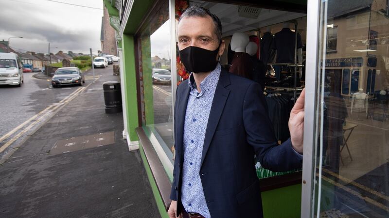 Owner Raymond Rooney of Peter’s Men’s Shop: Government  is “trying to stimulate the economy . . . the tone of the speeches is very positive, it’s about keeping hope.”  Photograph: Joe Dunne