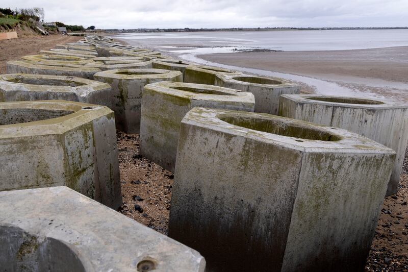 A short-term plan to fight erosion on Portrane beach has been to install a wall of giant, hexagonal concrete pillars called seabees. The idea is to fit them together in a long, honeycomb style wall to break the waves before they reach the dunes. Photograph: Chris Maddaloni