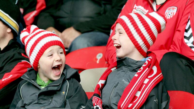 Young Derry City fans. “The club is more than just a club, it’s an identity. It’s hard to calculate what that identity means to people, but it’s in your veins.” Photograph:  Margaret McLaughlin/Inpho