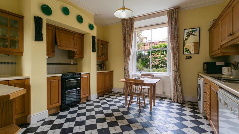 The kitchen is situated  at garden level and runs the depth of the house.