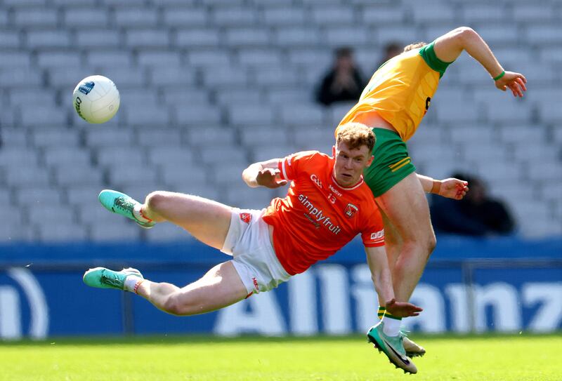 Armagh’s Conor Turbitt and Caolan McColgan of Donegal. Photograph: 
James Crombie/Inpho