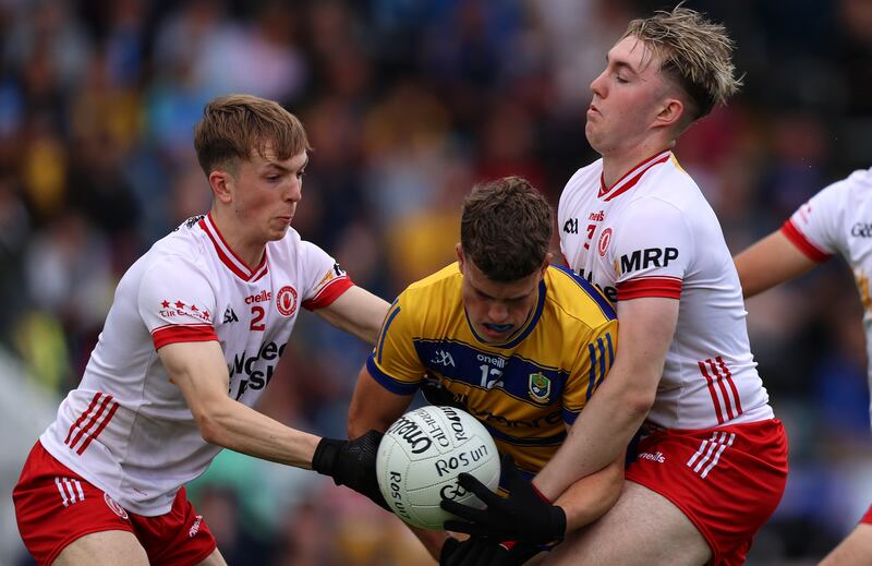 Tyrone's Elliott Kerr and Pádraig Goodman tackle Roscommon's Luke Shally. Photograph: Leah Scholes/Inpho