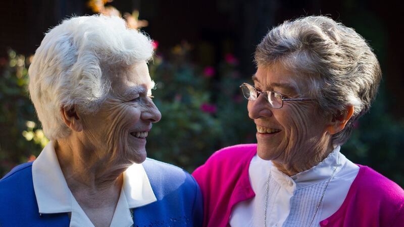 Sister Jo Murray  (left), and Sister Gabrielle Murray  grew up on a dairy farm in rural Ireland with  eight  siblings. Since entering the convent at 18, they have both traveled the world as teachers and nurses to help communities in need. Photo courtesy of the Murray family