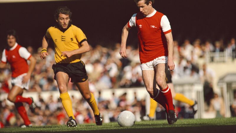 Midfield maestro: Liam Brady of Arsenal in action pursued by Peter Daniel of Wolves during a First Division match at Highbury on September 29th, 1979 in London. Photograph: Allsport/Getty Images