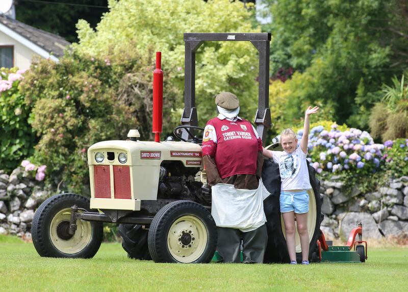 Young supporter Katie McDonagh shows her support for Galway footballers on the family farm at Billamore, Oughterard ahead of Sunday’s All-Ireland final against Kerry. Photograph: Joe O’Shaughnessy