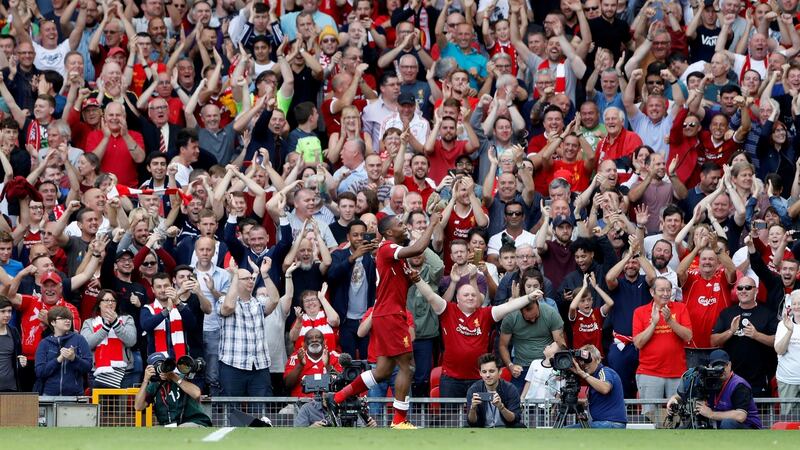 Liverpool’s Daniel Sturridge celebrates scoring their fourth goal. Photograph:  Carl Recine/Reuters