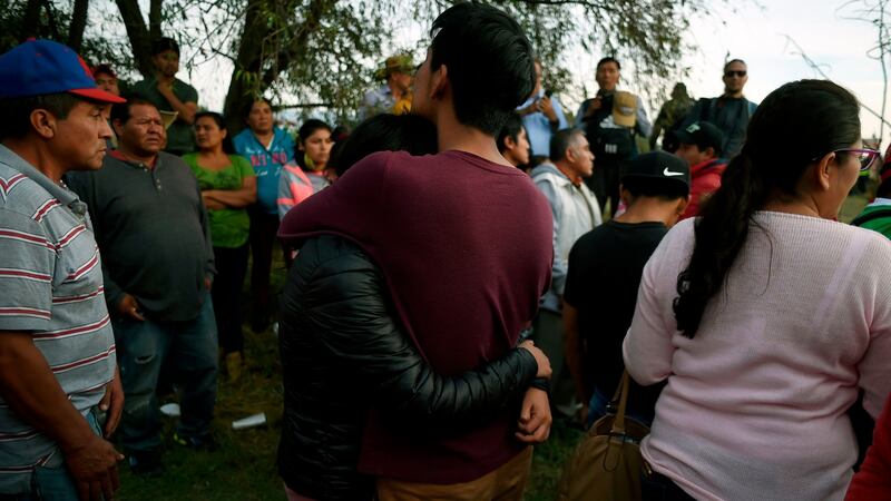 Relatives of dead and missing persons stand at the site of a massive blaze triggered by a leaky gasoline pipeline in Tlahuelilpan, Hidalgo state, Mexico. on January 19, 2019. Photograph: Alfredo Estrella/AFP/Getty Images