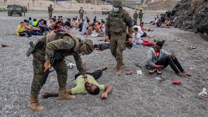 A migrant assisted by soldiers of the Spanish army near the border of Morocco and Spain, at the Spanish enclave of Ceuta, on May 18th. Photograph:  Bernat Armangue/AP